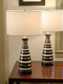 black, gold and white striped ceramic lamps